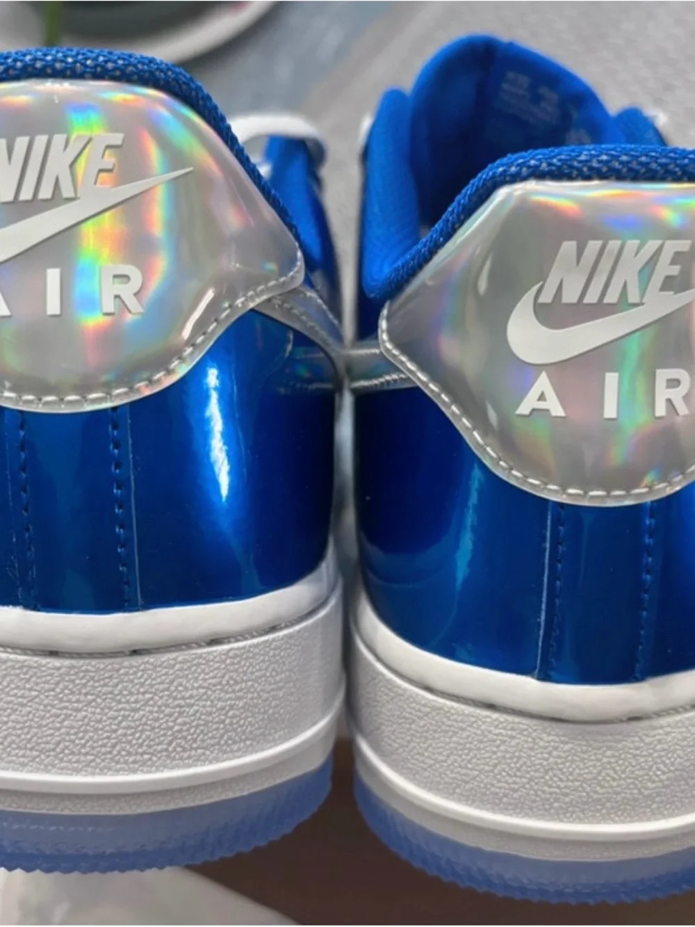 Nike Low-Top Sneakers in Bright Blue and White with Iridescent Swoosh